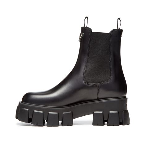 prada monolith brushed leather booties|More.